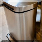 K16. Stainless steel waste bin.